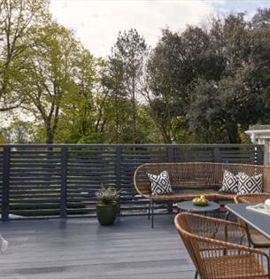 Hot tub, outside dining table and chairs on balcony at Eversley Apartment, Shanklin Villa, apartments, Isle of Wight, Self catering