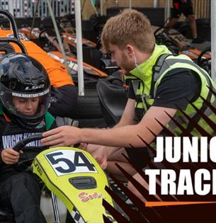 Man helping child with helmet before karting at Wight Karting, Ryde, Children's Events, junior track days