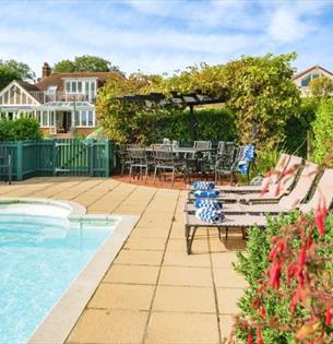 Outside pool with loungers, Island Holiday Homes, self catering, Isle of Wight