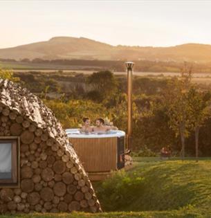 Outside view of Modulog with hot tub at Tapnell Farm, Isle of Wight, glamping, self catering - image credit: Skarsgard
