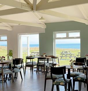 Table and chairs inside the cafe at Isle of Wight Pearl, food and drink, shopping