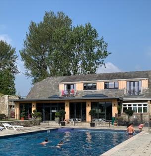 Outside view of The Core Complex overlooking the swimming pool at Appuldurcombe Gardens Holiday Park, Isle of Wight