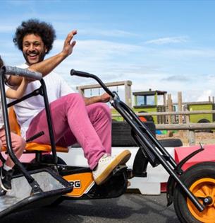 Father and daughter on the go karts at Tapnell Farm Park, Isle of Wight, attraction, family fun, activities