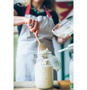 Lady putting sourdough in glass jar, workshops at the Garlic Farm, Isle of Wight, food event, what's on