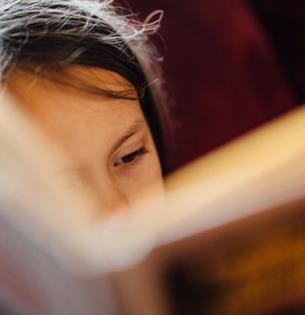 Child reading a book, book event at Quarr Abbey, Ryde, Isle of Wight, family event, what's on, children's activities