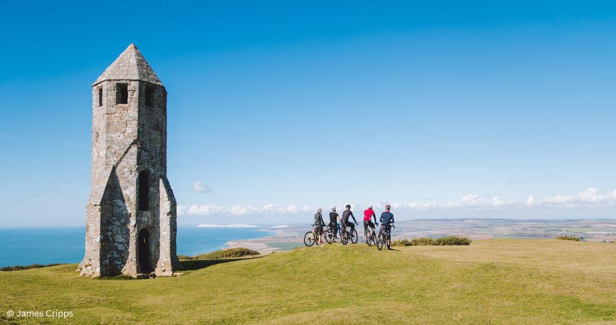 Group of cyclists looking at the view from the Pepperpot