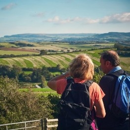 Couple of walkers taking in the view of the rolling countryside