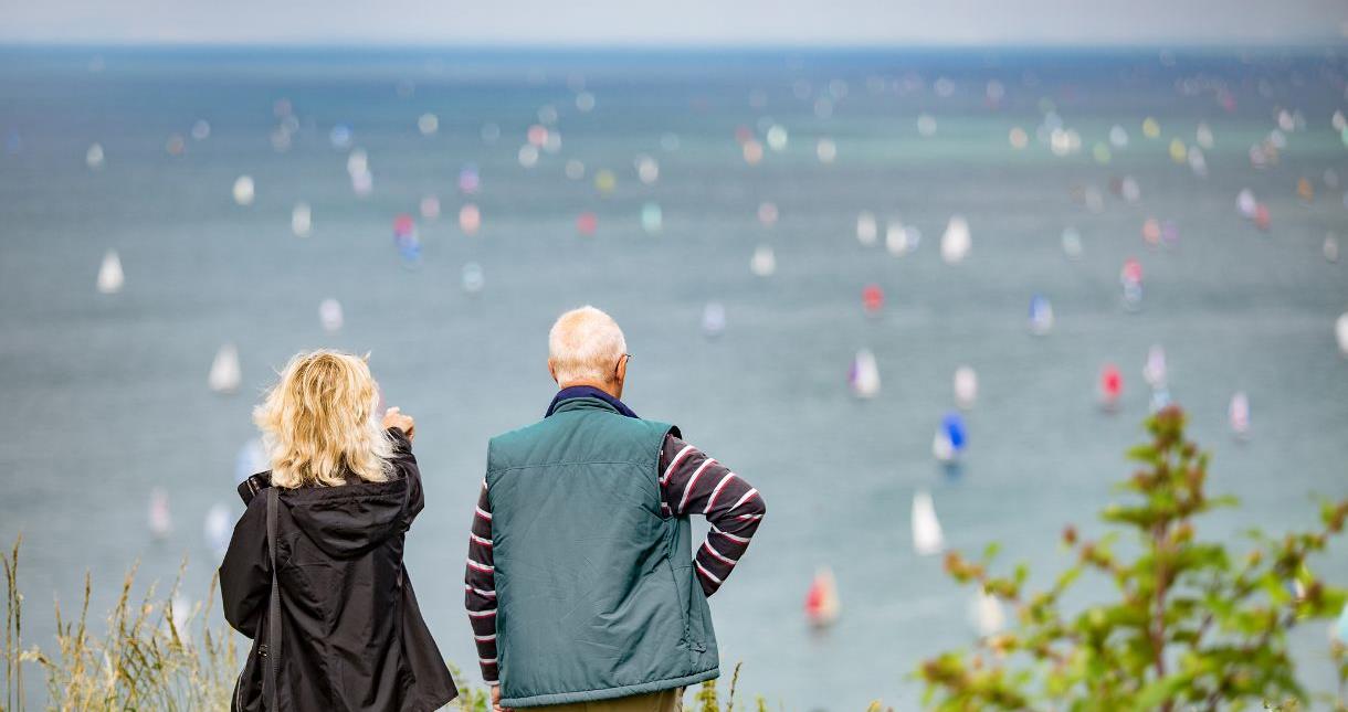 Couple watching the Round the Island Race on the Isle of Wight