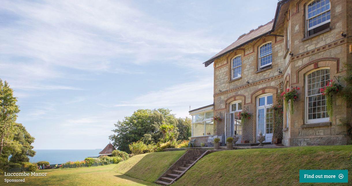 Outside view of Luccombe Manor and gardens with sea view