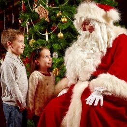 Two children meeting Father Christmas at Osborne House, Isle of Wight