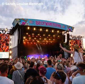 Crowd watching a band on the main stage at the Isle of Wight Festival