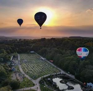 Credit - IOWightDrone - hot air balloons floating above Robin Hill