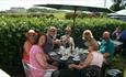 Group sitting outdoors having refreshments, Isle of Wight Guided Tours, Things to Do
