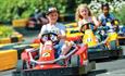Children racing in karts at Sandham Gardens, Sandown, Things to Do
