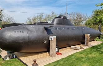 Outside view of HMS Bond submarine at Windmill Campersite, Isle of Wight, Glamping