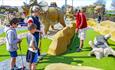 Family playing on Dino Islands golf at Sandham Gardens, Sandown, Things to Do