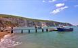 Pleasure cruise docked at pier on Alum Bay beach, Isle of Wight, Things to Do