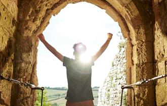 Boy looking out from the top of the tower at Carisbrooke Castle, Isle of Wight, What's On, events