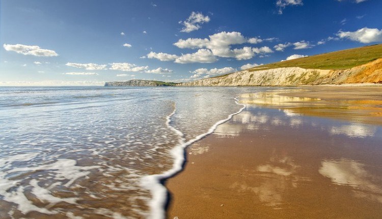 Sunny day with few clouds in the sky over Compton Beach, Isle of Wight, Things to Do