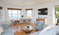 Lounge and dining area with sea views in Cromwell Apartment, Shanklin Villa Aparthotel, Isle of Wight, Self catering