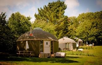 Outside view of yurts at The Garlic Farm, Isle of Wight