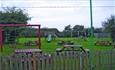 Outside play area and seating area at The Fighting Cocks, Arreton, pub