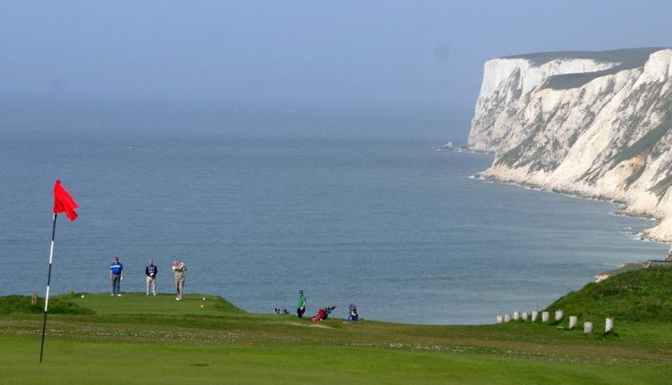 Group of people playing at Freshwater Golf Club with the English Channel in the background, Isle of Wight, activities