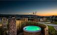 Hot tub with a sunset view at Whitecliff Bay Holiday Park, Isle of Wight