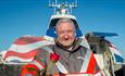 Crew member holding a rose in front of the hovercraft, romantic experience, Hovertravel, Isle of Wight