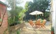 Patio with outside table and chairs at Romany Cottage, Self-catering, Isle of Wight