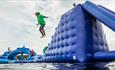 Boy jumping off Mount Hood at the Isle of Wight Aqua Park, Tapnell Farm, Isle of Wight, Things to Do