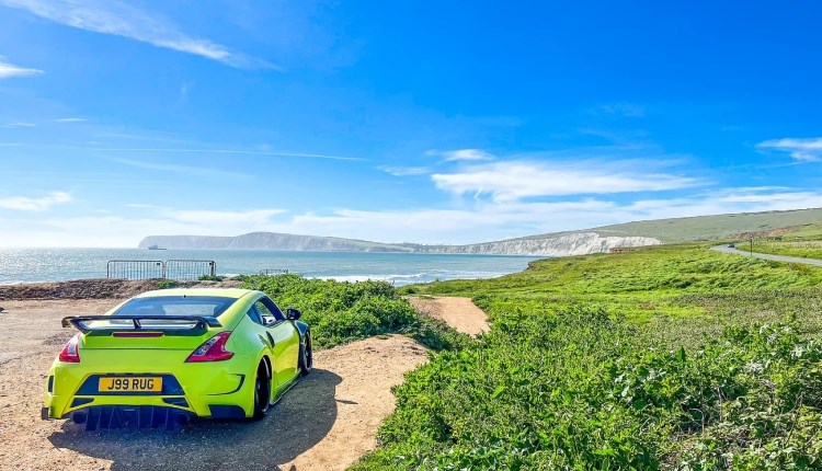Isle of Wight, Things to do, Takeover, Car enthusiasts, County Showground, image of car overlooking bay from Compton Bay Carpark