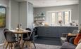 Kitchen and dining area at The Bowling Green Apartment at Carisbrooke Castle, self catering, historic place to stay, Isle of Wight