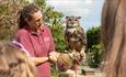 People meeting the owls at Monkey Haven, sanctuary, Isle of Wight, Things to Do - copyright: Jason Swain