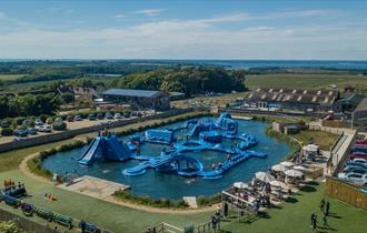 Aerial view of Isle of Wight Aqua Park at Tapnell Farm, outdoor watersports, activities, Isle of Wight