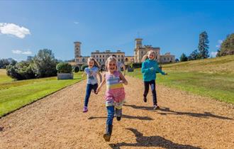Children running along the path in front of Osborne House, May Half Term fun, events, what's on, Isle of Wight