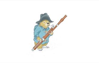 Paddington Bear playing a bassoon, Wight Proms Wednesdays - Family Concerts, events, what's on, Cowes, Isle of Wight