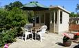 Outside dining area on patio in garden of Weirside Cottage, Isle of Wight, Accommodation, Self Catering, Brighstone