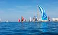 Yachts sailing around the Needles, Round the Island Race, Isle of Wight, Credit: Paul Wyeth