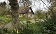 Outside view of Pheasant Cottage surrounded by countryside, Godshill Farm Cottages, Isle of Wight, Self Catering