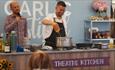 Robert Thompson cooking in the theatre kitchen at the Isle of Wight Garlic Festival, what's on, event, Newchurch