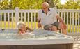 Couple enjoying the hot tub at The Lakes Rookley Holiday Resort, Isle of Wight, Self Catering