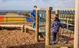 Children playing on the trim trail at Tapnell Farm Park, Things to Do, Isle of Wight