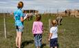 Children watching the animals in the paddock at Tapnell Farm Park, Things to Do, Isle of Wight