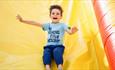 Boy sliding down the bouncy slide, Bouncy Barn, Tapnell Farm Park, children's event, what's on
