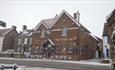 Outside view of The Vine Inn in the snow, pub, St Helens