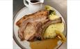 Pork steak, apple mash and gravy meal at The Vine Inn, St Helens, pub