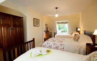 Twin bedroom at Wydcombe Holiday Cottage, National Trust, Isle of Wight, self catering, image credit: John Plimmer