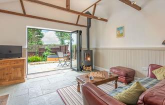The Stables living room with french doors opening to the garden with hot tub - Kingates Farm Cottages, Isle of Wight, Self Catering The Stables living room with french doors opening to the garden with hot tub - Kingates Farm Cottages, Isle of Wight, Self Catering