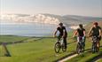 Adults cycling along the cliff, Wight Cycle Hire, Isle of Wight